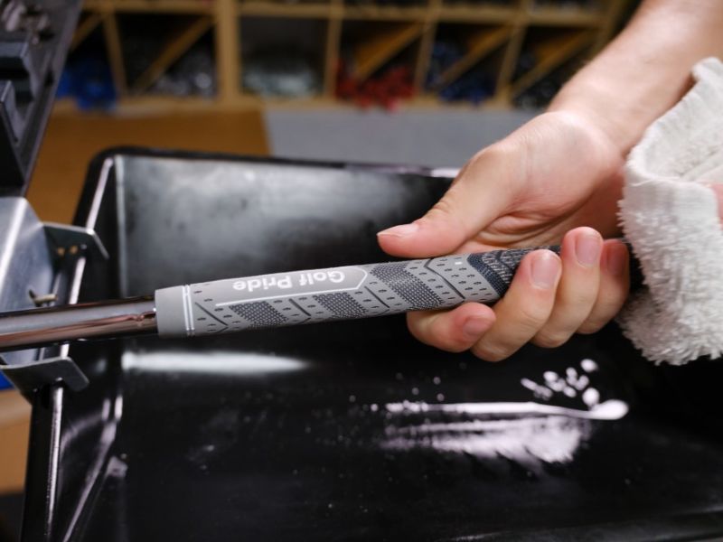 Golf club being repaired with Golf Pride Grey grip 