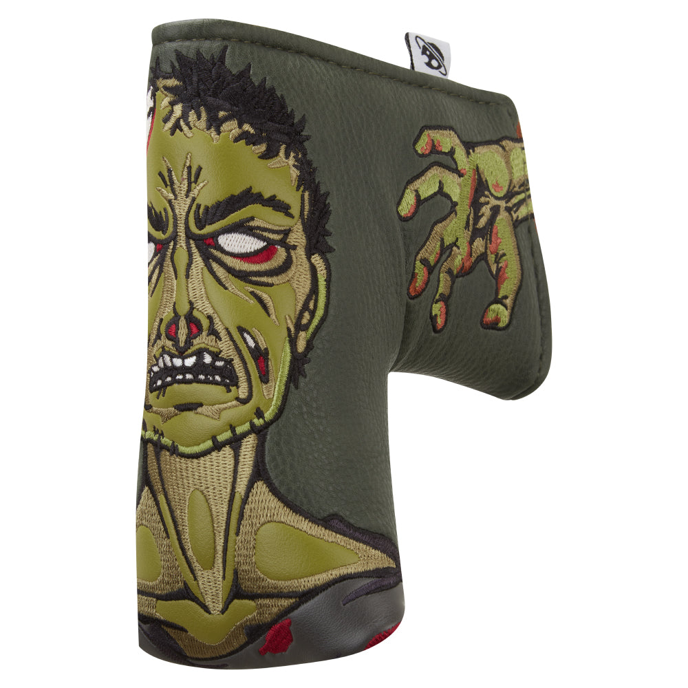 Blade putter head cover with unique embroidered zombie design set on a deep green background. 