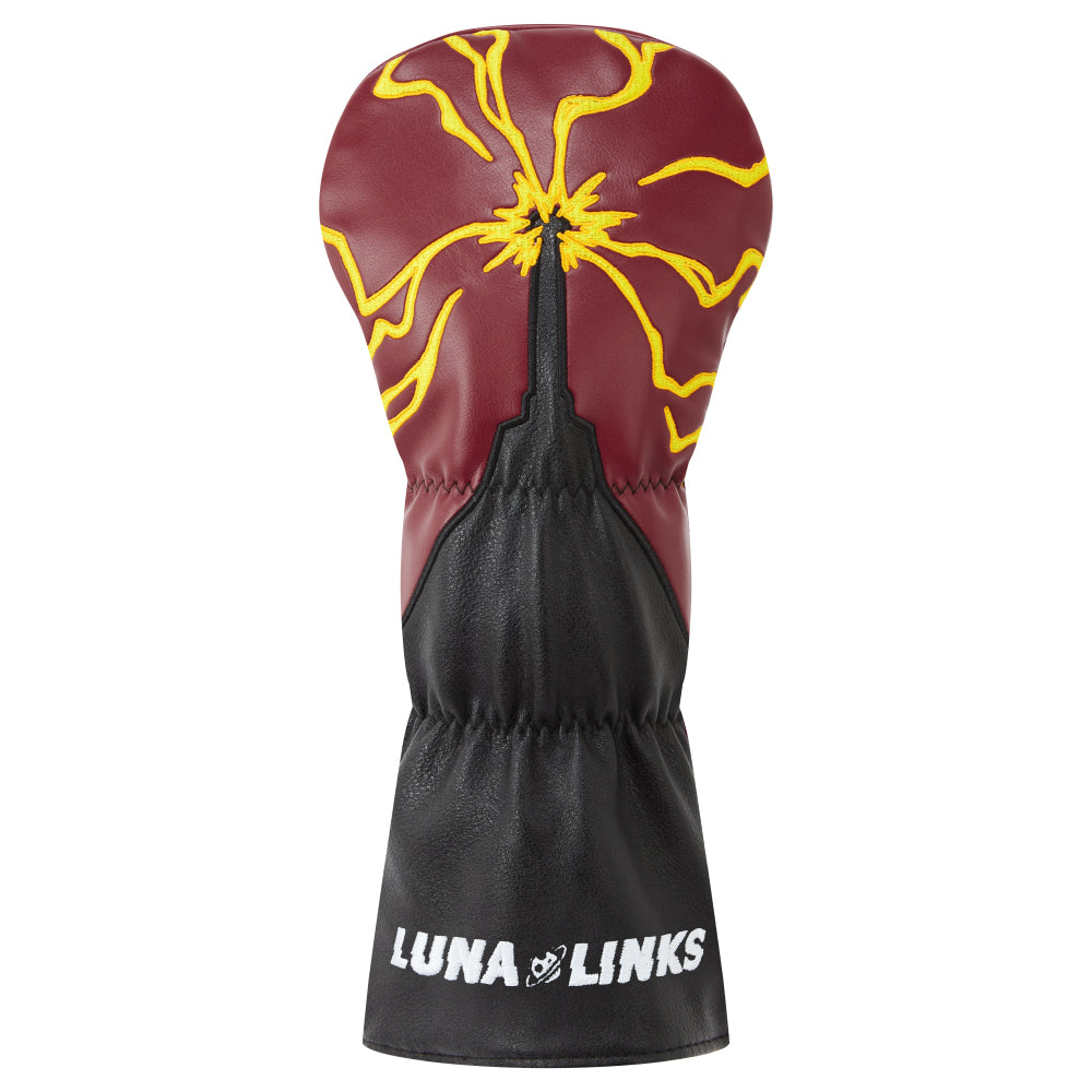 Driver head cover with red and yellow embroidered design on a faux leather background. 