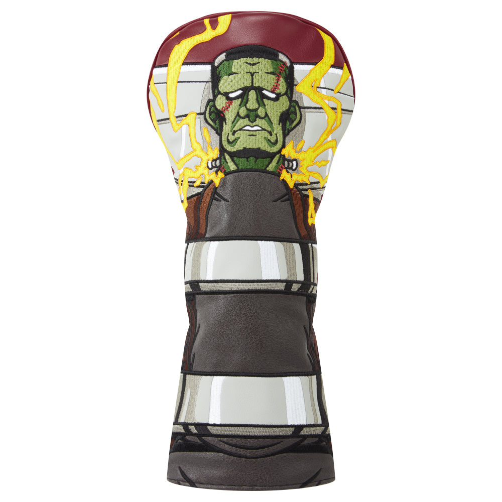 Driver head cover with Frankenstein embroidered design on a multicoloured faux leather background.