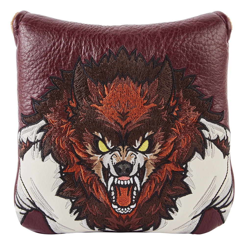 Mallet putter head cover with unique embroidered werewolf design on a burgundy faux leather background. 